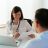 Female doctor talking to patient